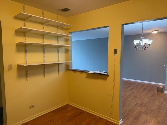 801 79th Street, Unit 310 Darien, IL 60561 - Photo 9 of 18 a view of walk in closet with empty racks