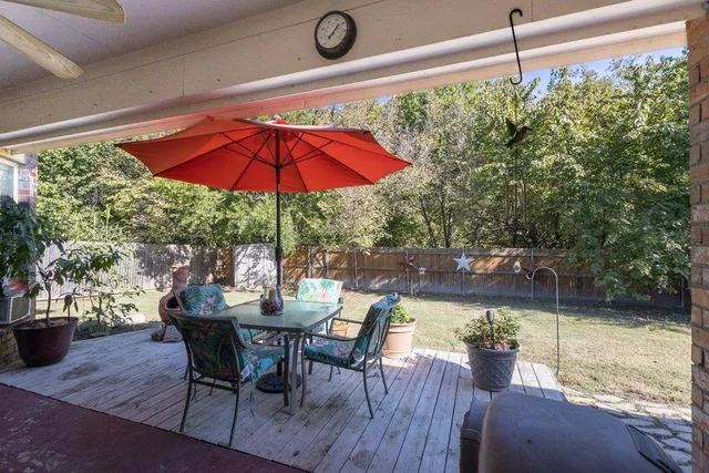 a view of a table and chairs in patio