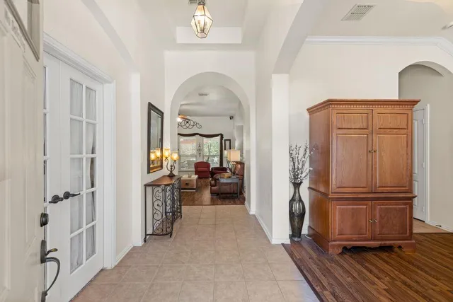 a view of hallway with livingroom and furniture