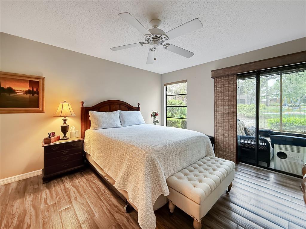 1001 Lennox Road West Palm Harbor, FL 34683 - Photo 17 of 27 a bedroom with a bed and wooden floor