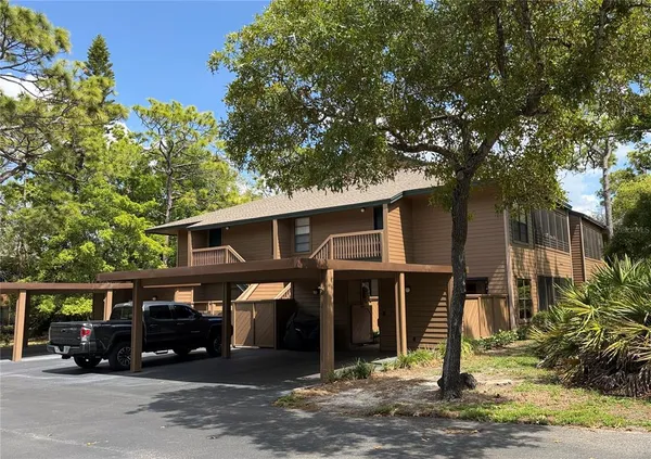 a view of a car park in front of house