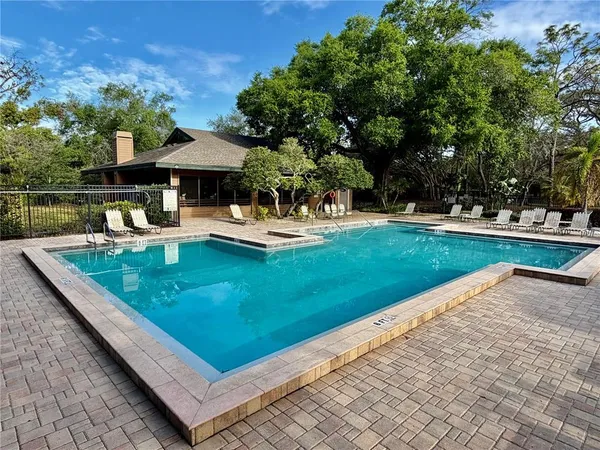 a view of a yard with swimming pool