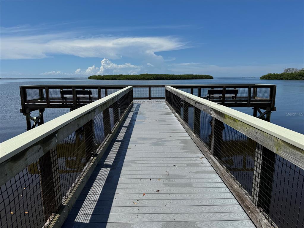 1001 Lennox Road West Palm Harbor, FL 34683 - Photo 26 of 27 a view of balcony with wooden floor and seating