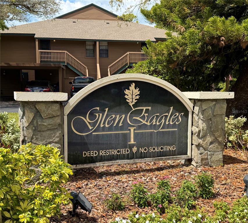 1001 Lennox Road West Palm Harbor, FL 34683 - Photo 7 of 27 a view of outdoor space with signage and flags