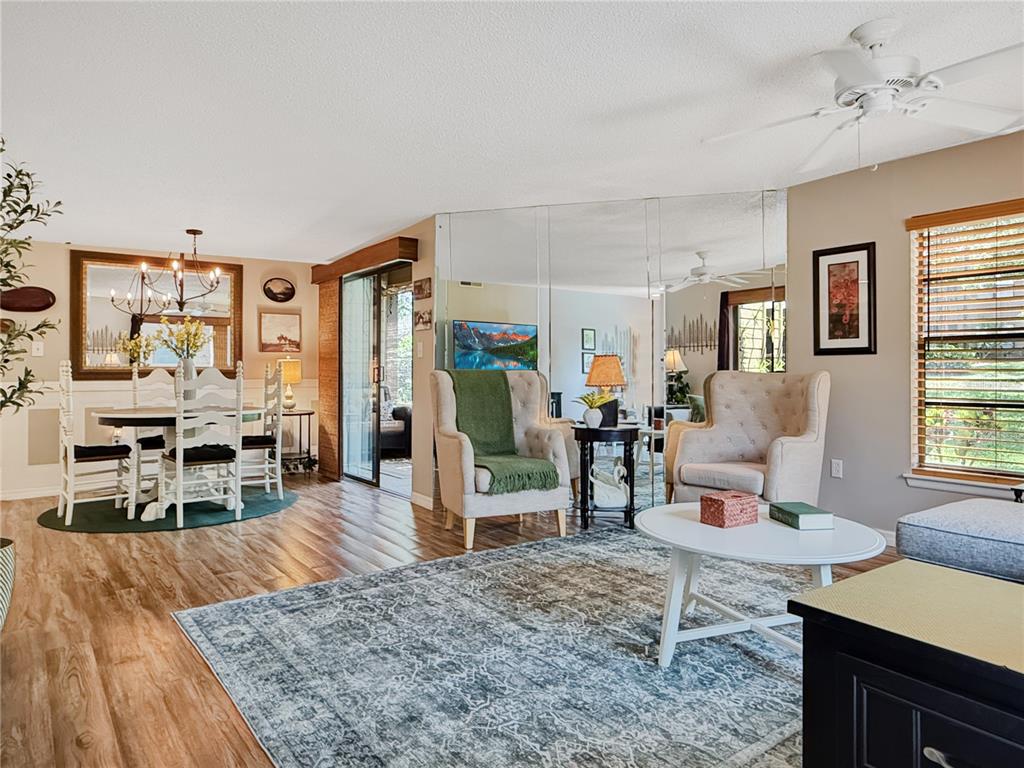 1001 Lennox Road West Palm Harbor, FL 34683 - Photo 9 of 27 a living room with furniture and a wooden floor