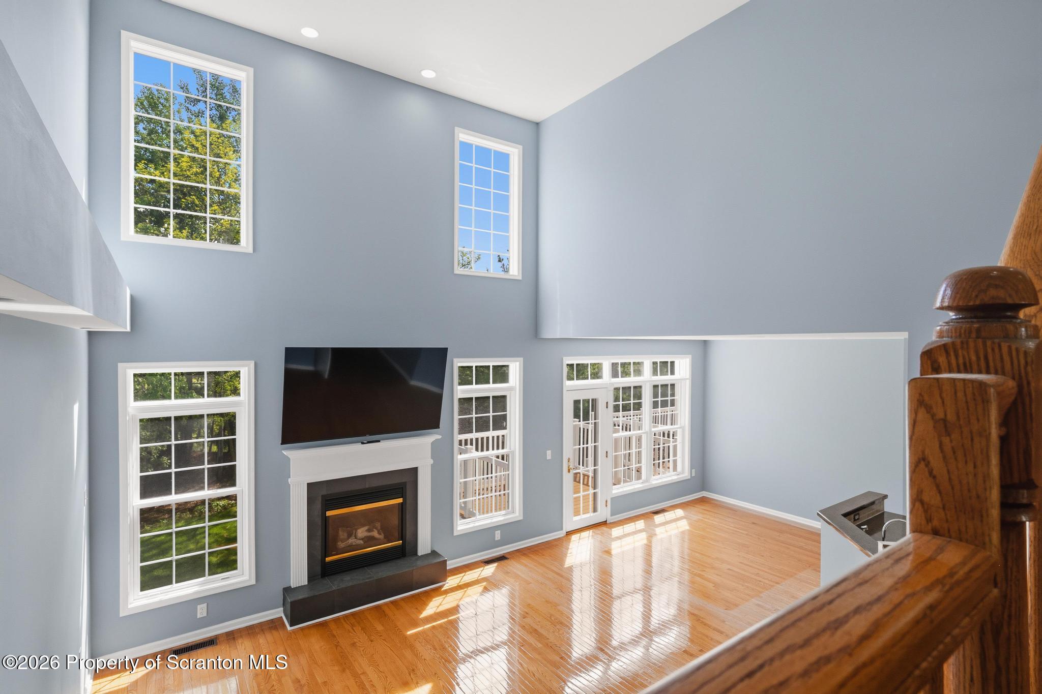 1502 Verne Cl Moosic, PA 18507 - Photo 9 of 46 a view of an empty room with a fireplace and a window