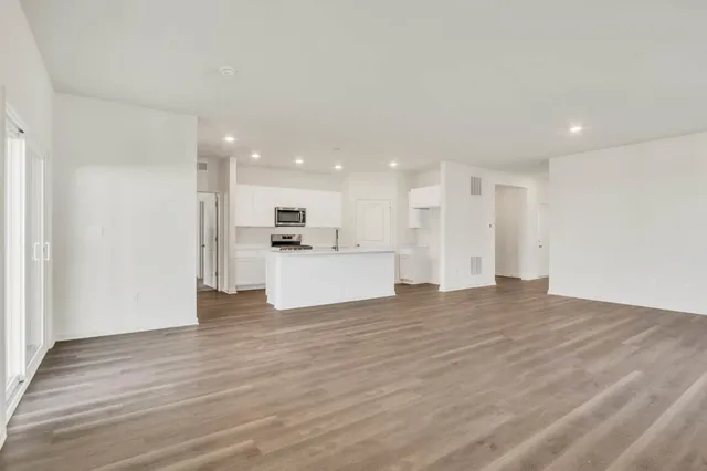 a view of kitchen with wooden floor