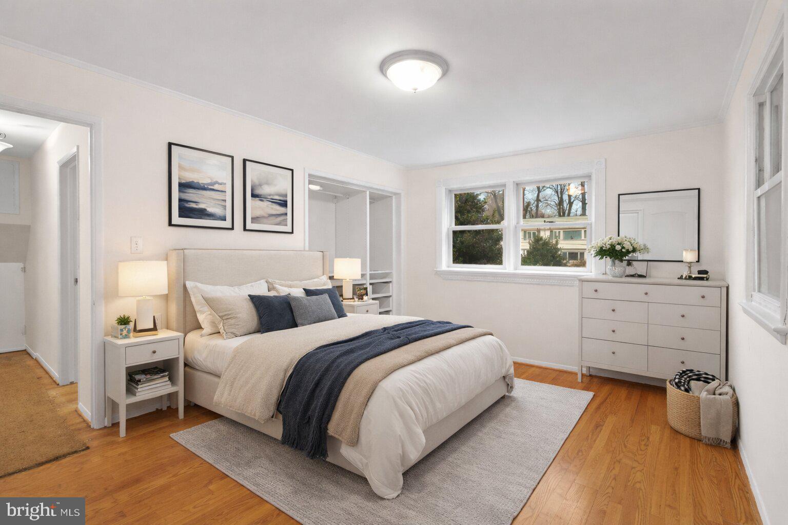 7423 Exmore Street Springfield, VA 22150 - Photo 18 of 39 a bedroom with a bed and a dresser