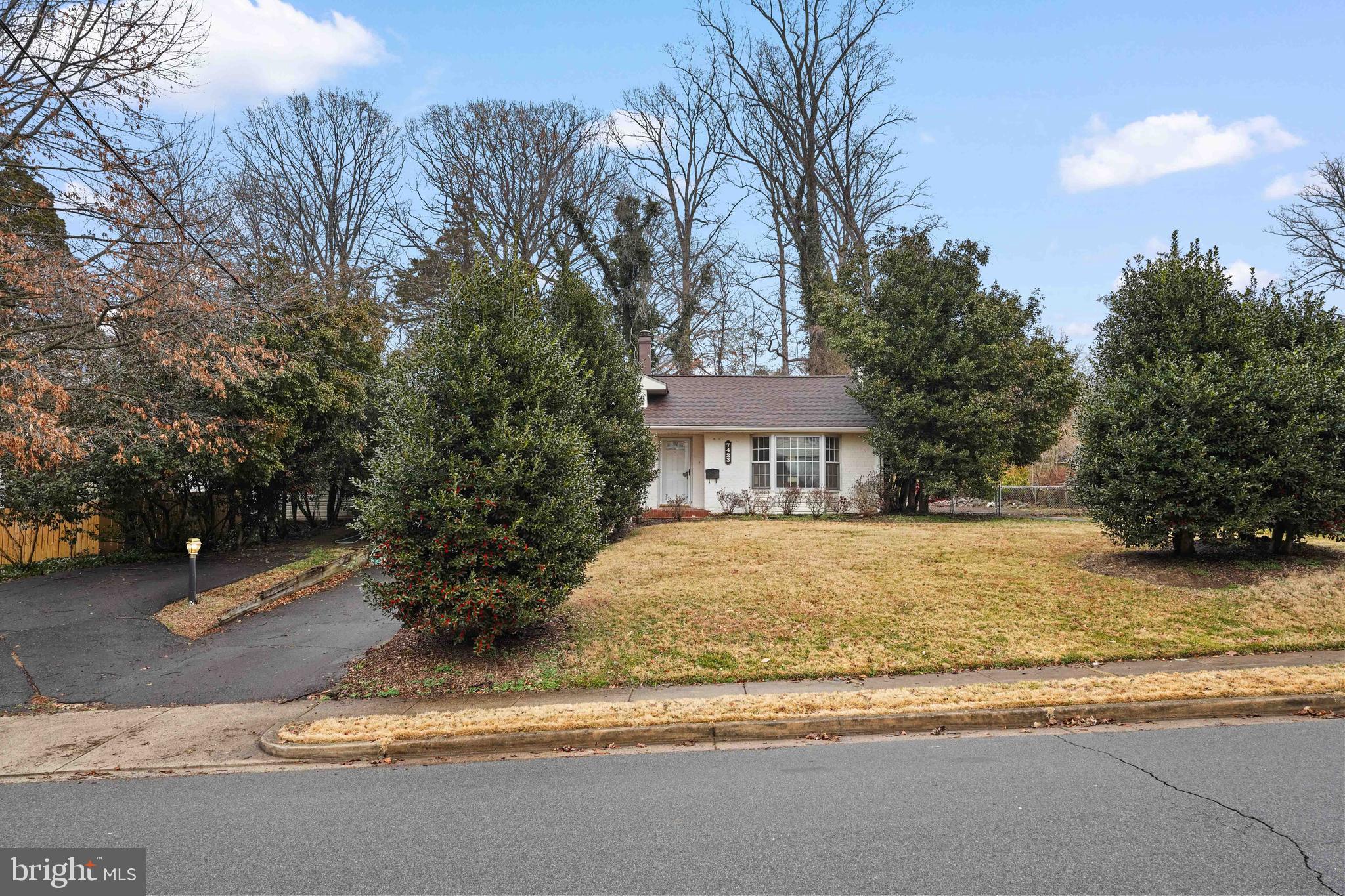 7423 Exmore Street Springfield, VA 22150 - Photo 2 of 39 a front view of a house with a yard