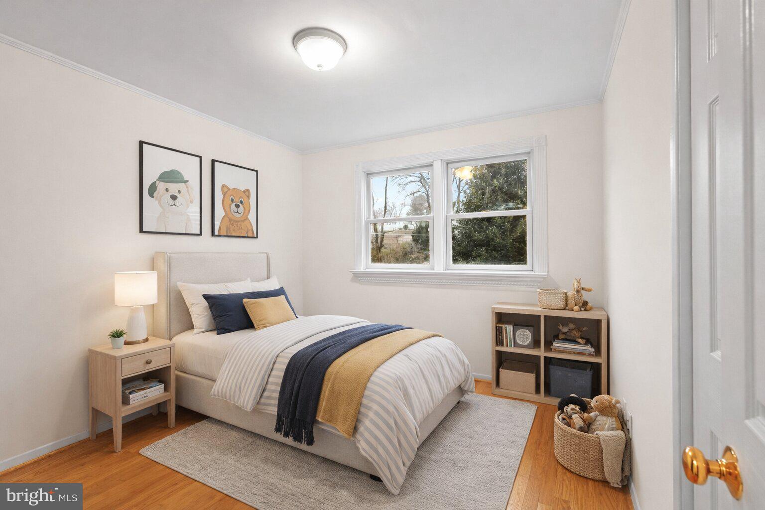 7423 Exmore Street Springfield, VA 22150 - Photo 21 of 39 a bedroom with a bed and a couch