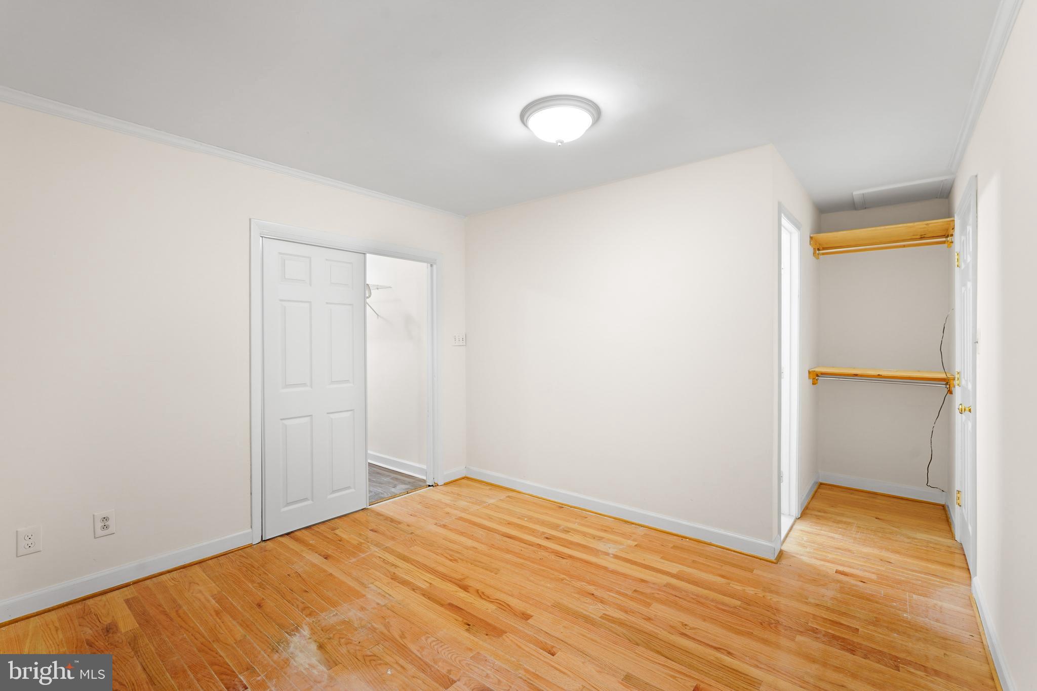 7423 Exmore Street Springfield, VA 22150 - Photo 23 of 39 a view of empty room with wooden floor