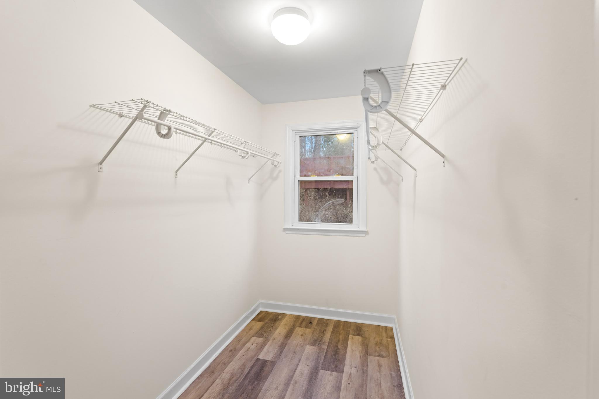 7423 Exmore Street Springfield, VA 22150 - Photo 26 of 39 a view of a room with racks on the wall