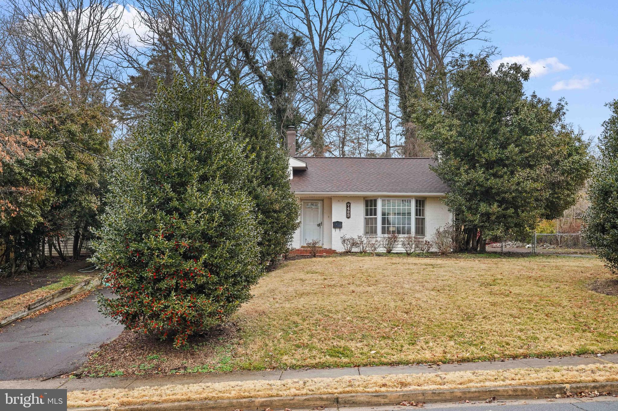7423 Exmore Street Springfield, VA 22150 - Photo 3 of 39 a front view of a house with yard porch and tree