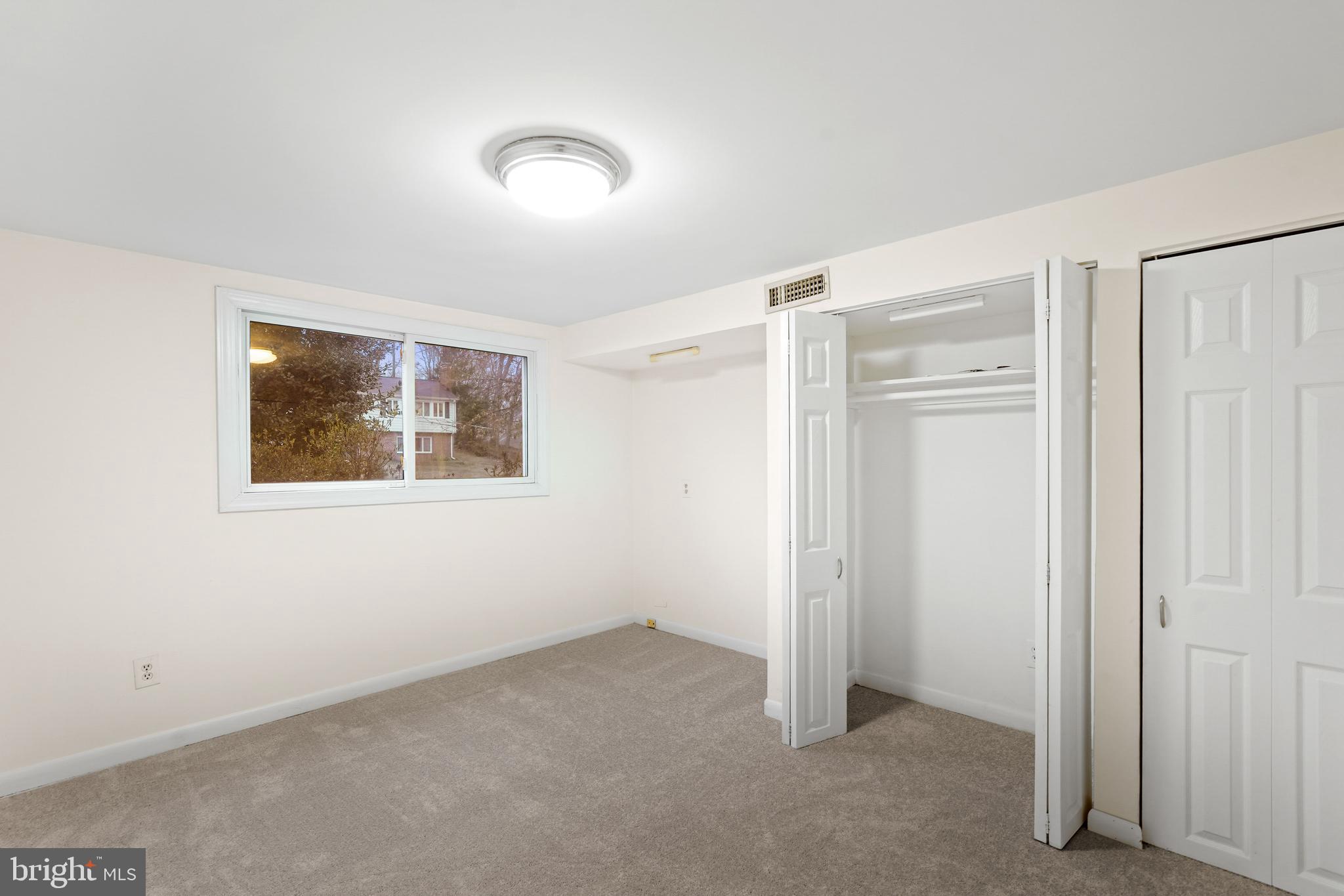 7423 Exmore Street Springfield, VA 22150 - Photo 31 of 39 a view of an empty room with a window