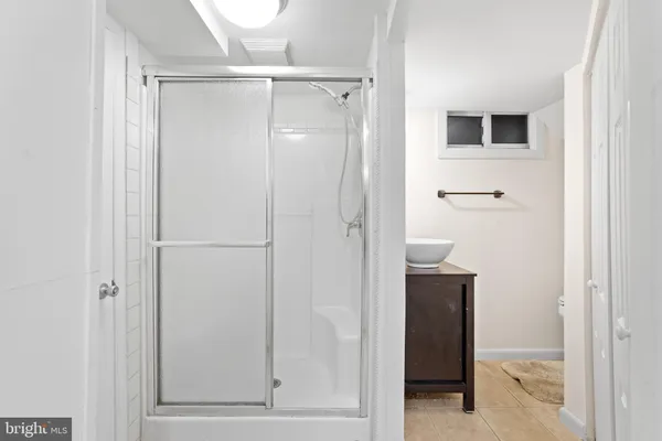 a bathroom with a shower and a toilet