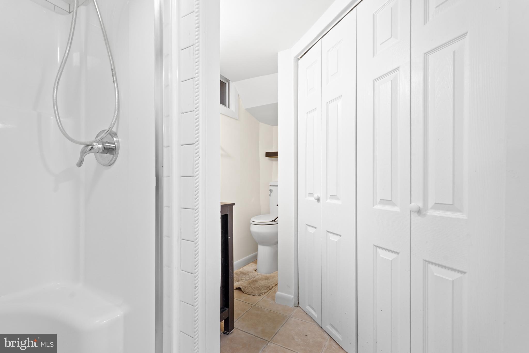 7423 Exmore Street Springfield, VA 22150 - Photo 35 of 39 a bathroom with a shower and a toilet