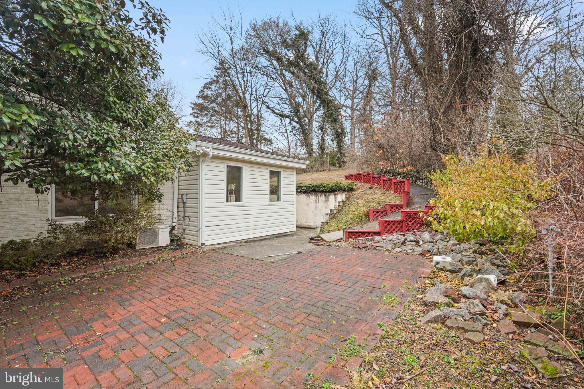 7423 Exmore Street Springfield, VA 22150 - Photo 37 of 39 a view of a house with a tree and yard
