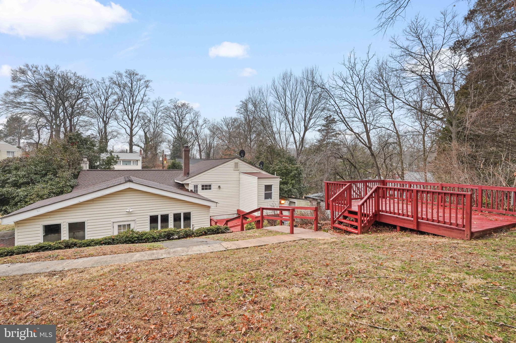 7423 Exmore Street Springfield, VA 22150 - Photo 38 of 39 a view of a house with a yard and wooden fence