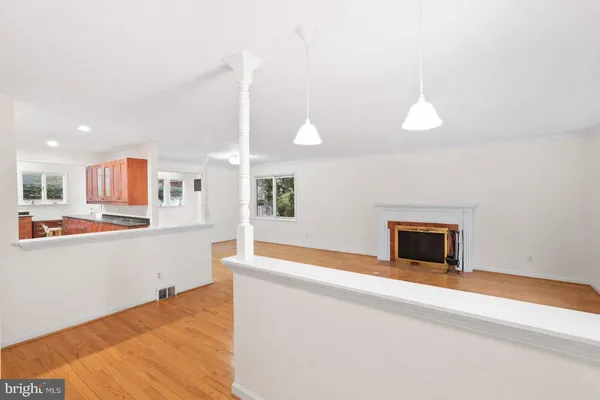 a view of a kitchen with microwave and floor to ceiling window