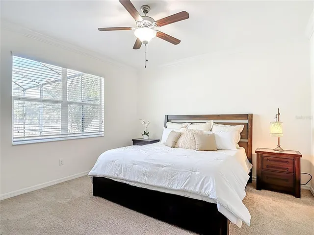 a bedroom with a bed and cabinets