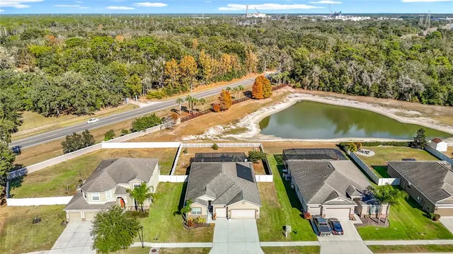 an aerial view of a house with outdoor space