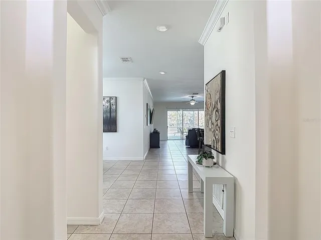 a view of a dining room with furniture and window
