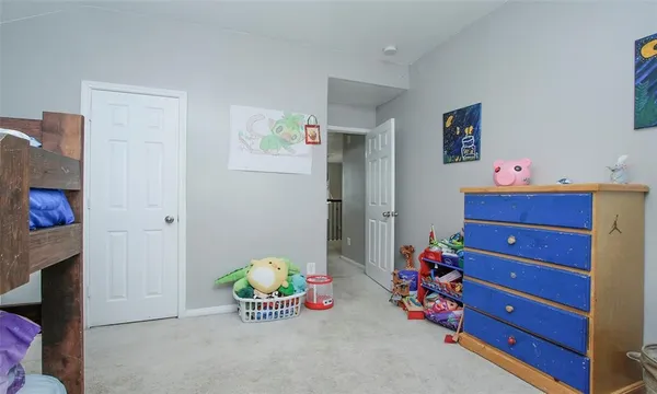 a bedroom with a bed and furniture