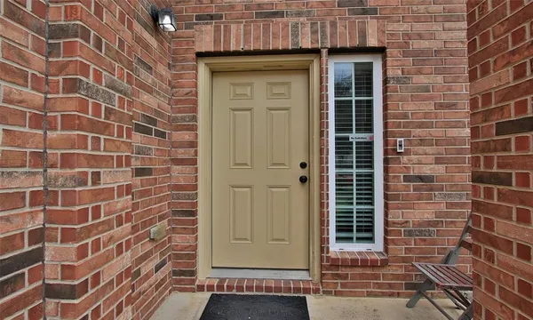 a view of a brick house with a door