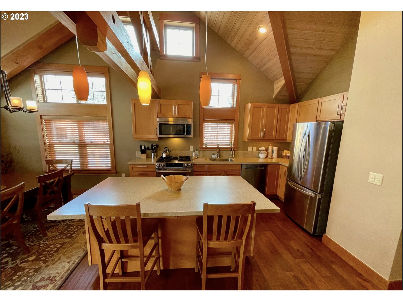 Lodges At Cannon Bea, Unit B2 Cannon Beach, OR 97110 - Photo 10 of 25 a view of a dining room with furniture window and wooden floor
