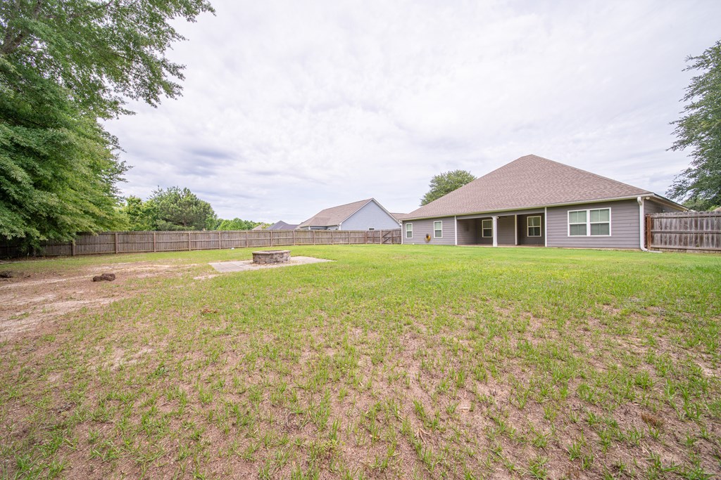 16 Maxwell Drive Fort Mitchell, AL 36856 - Photo 9 of 25 a view of a house with a yard and a large tree