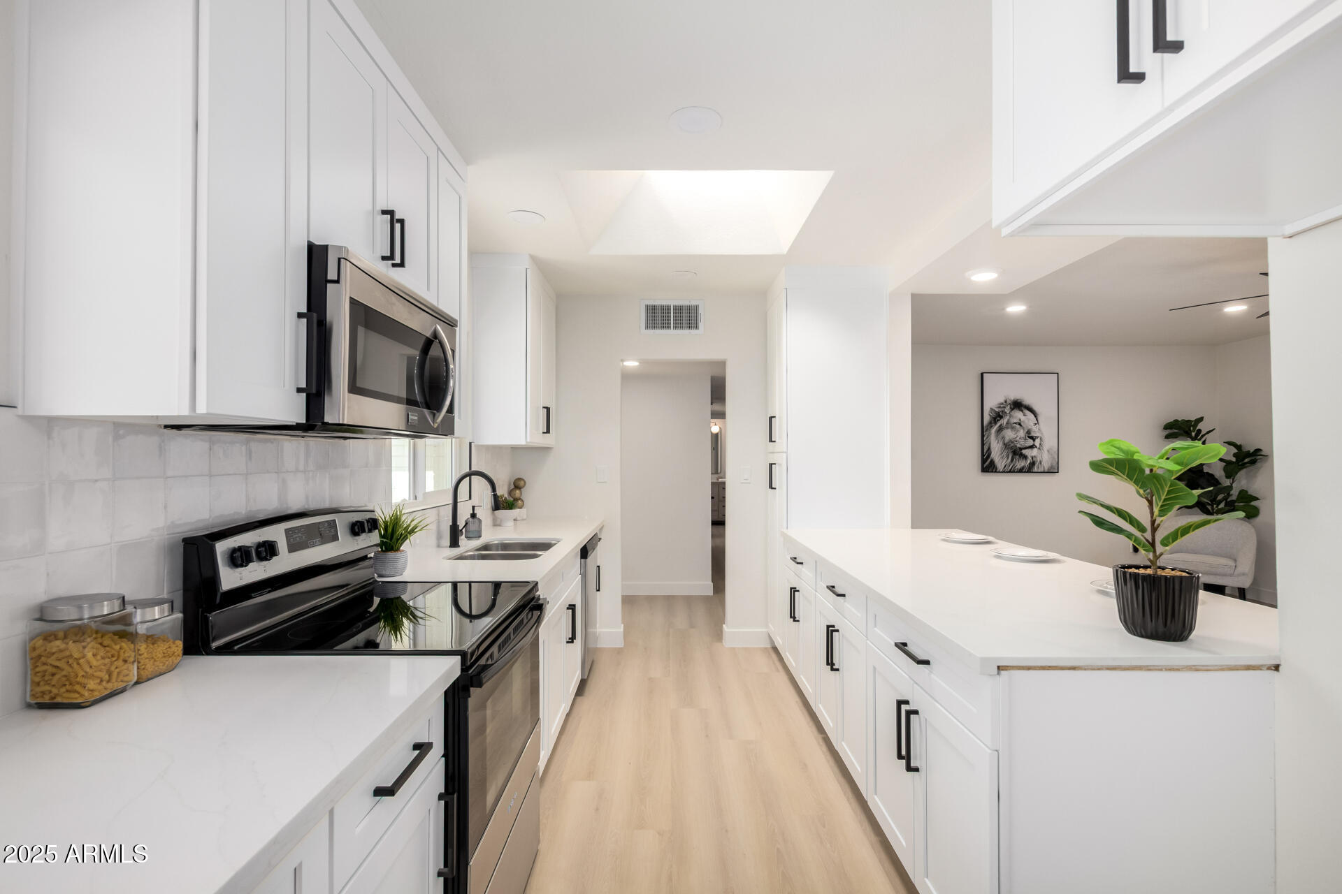 443 North Sycamore Mesa, AZ 85201 - Photo 12 of 42 a kitchen with a sink a stove and cabinets