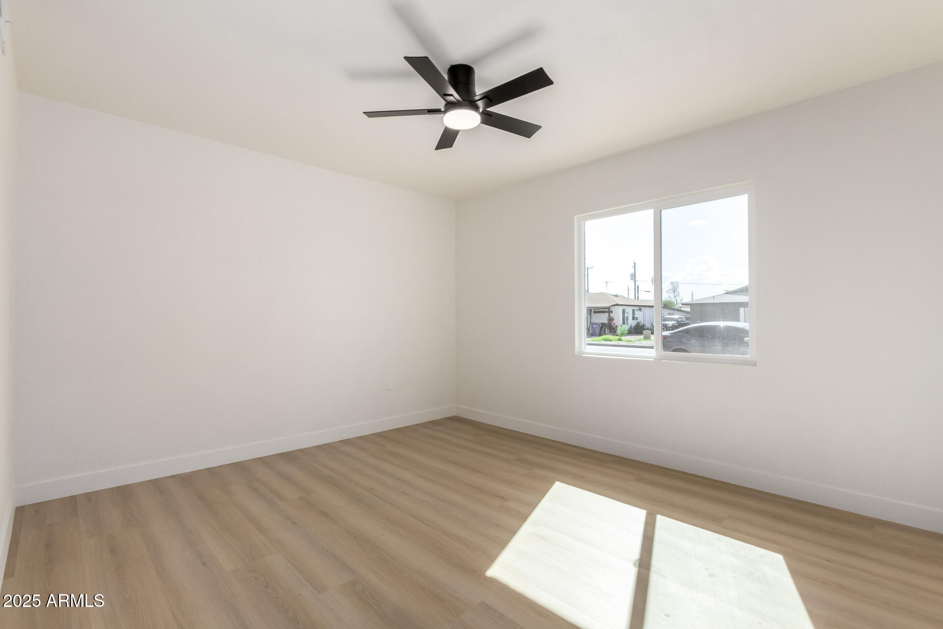 443 North Sycamore Mesa, AZ 85201 - Photo 17 of 42 an empty room with wooden floor and windows