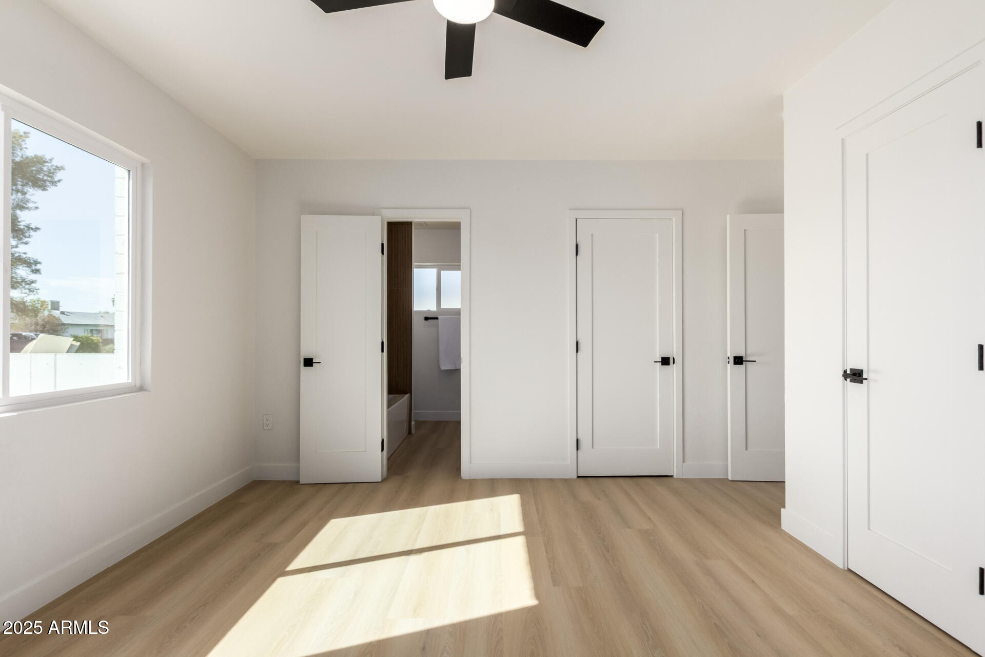 443 North Sycamore Mesa, AZ 85201 - Photo 19 of 42 a view of an empty room with window and wooden floor
