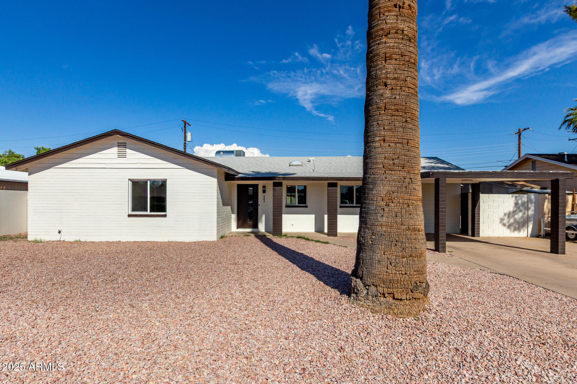 443 North Sycamore Mesa, AZ 85201 - Photo 2 of 42 a front view of a house with a yard and garage