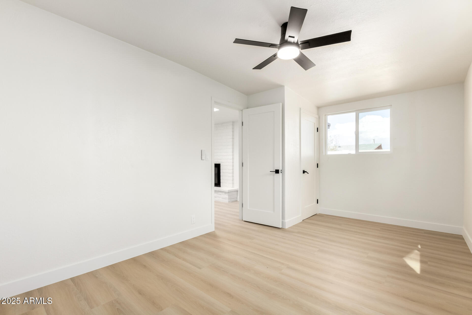 443 North Sycamore Mesa, AZ 85201 - Photo 24 of 42 an empty room with wooden floor and windows