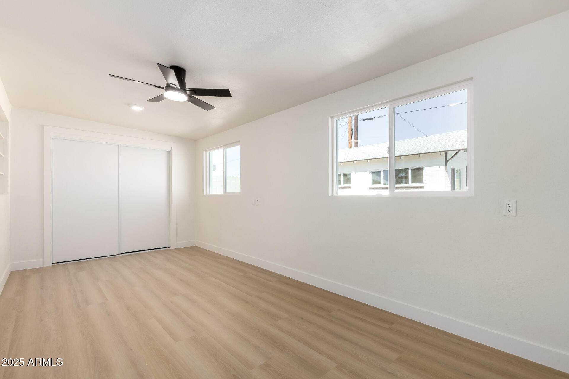 443 North Sycamore Mesa, AZ 85201 - Photo 25 of 42 a view of empty room with wooden floor and fan