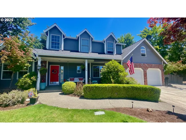 a view of a house with a garden and a garden