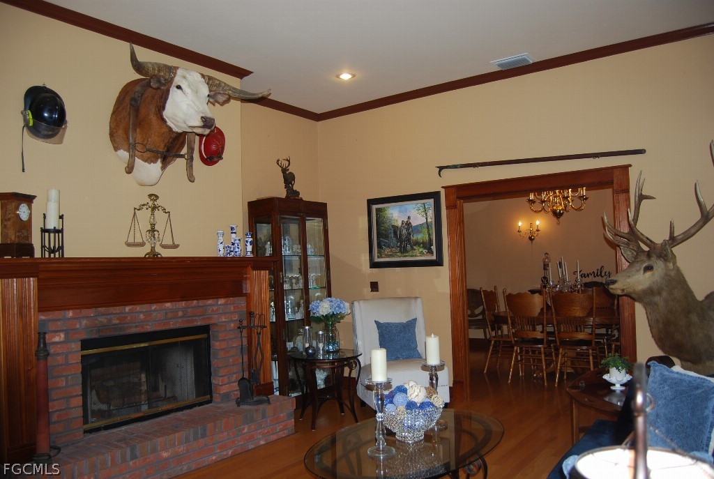 3480 4th Avenue Southeast Naples, FL 34117 - Photo 11 of 15 a living room with furniture and a fireplace