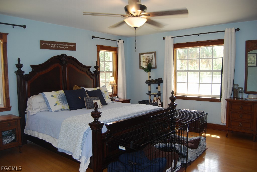 3480 4th Avenue Southeast Naples, FL 34117 - Photo 15 of 15 a living room with furniture a bed and a window