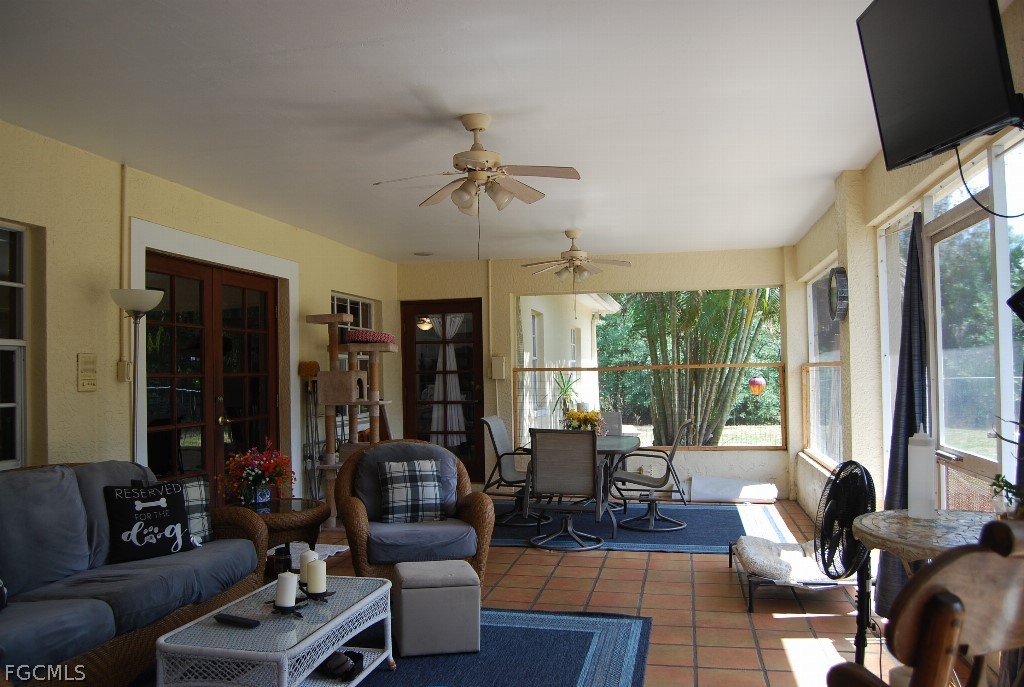 3480 4th Avenue Southeast Naples, FL 34117 - Photo 3 of 15 a living room with furniture ceiling fan and a window