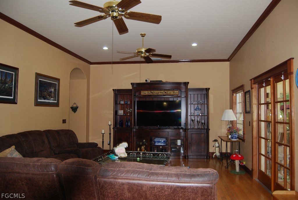 3480 4th Avenue Southeast Naples, FL 34117 - Photo 5 of 15 a living room with furniture and a flat screen tv