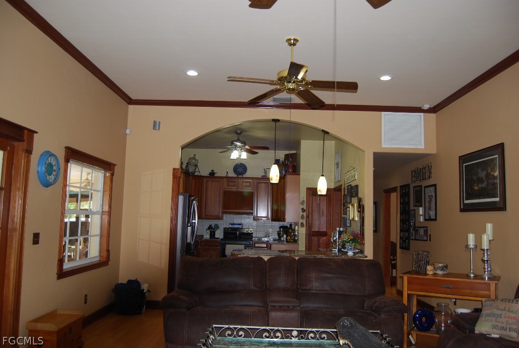 3480 4th Avenue Southeast Naples, FL 34117 - Photo 6 of 15 a view of a living room and a livingroom with furniture