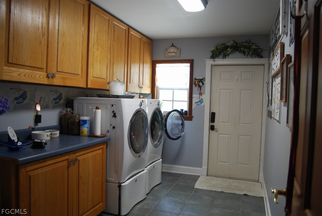 3480 4th Avenue Southeast Naples, FL 34117 - Photo 9 of 15 a utility room with fridge and washer