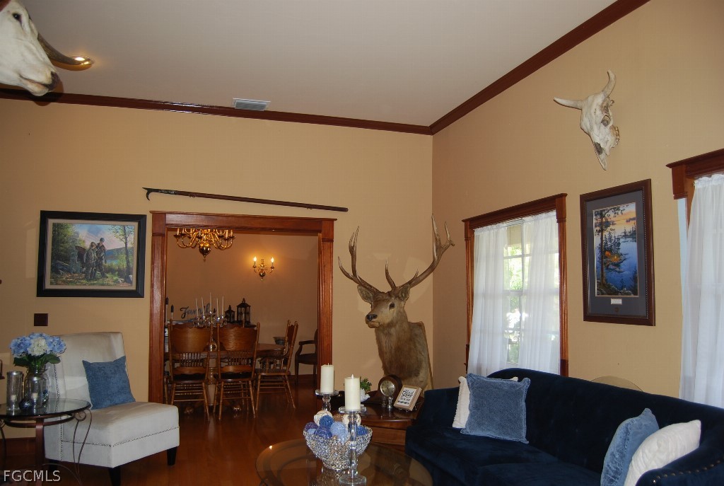 3480 4th Avenue Southeast Naples, FL 34117 - Photo 10 of 15 a living room with furniture and a window