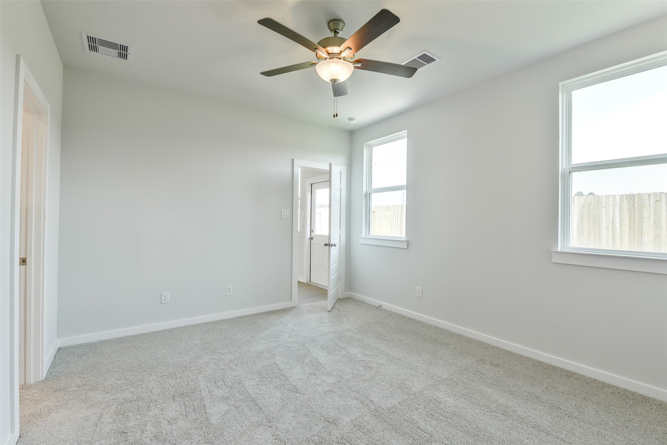 25984 Liberation Road Cleveland, TX 77328 - Photo 19 of 35 a view of an empty room with a window
