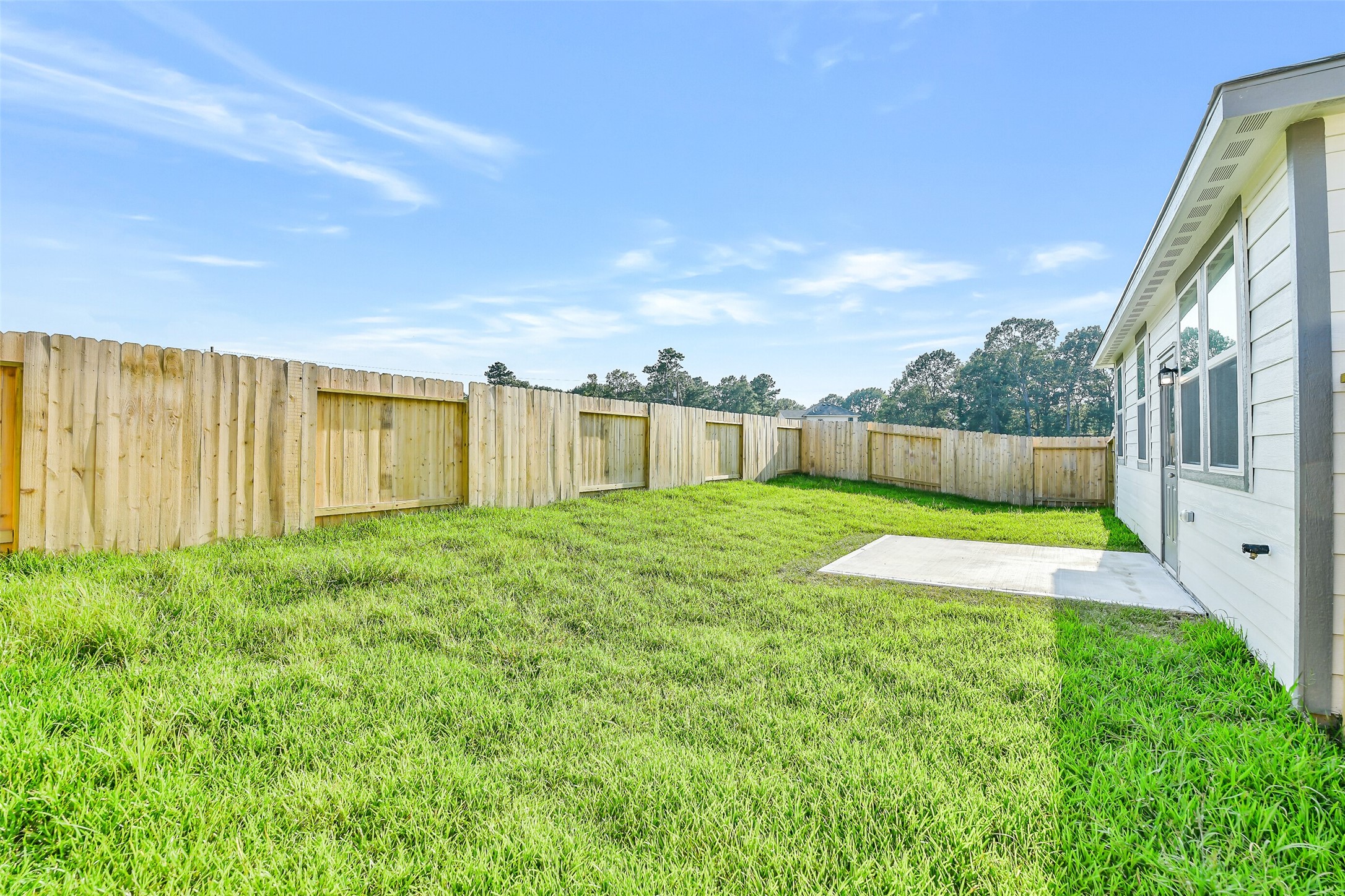 25984 Liberation Road Cleveland, TX 77328 - Photo 34 of 35 a view of an house with backyard space and balcony