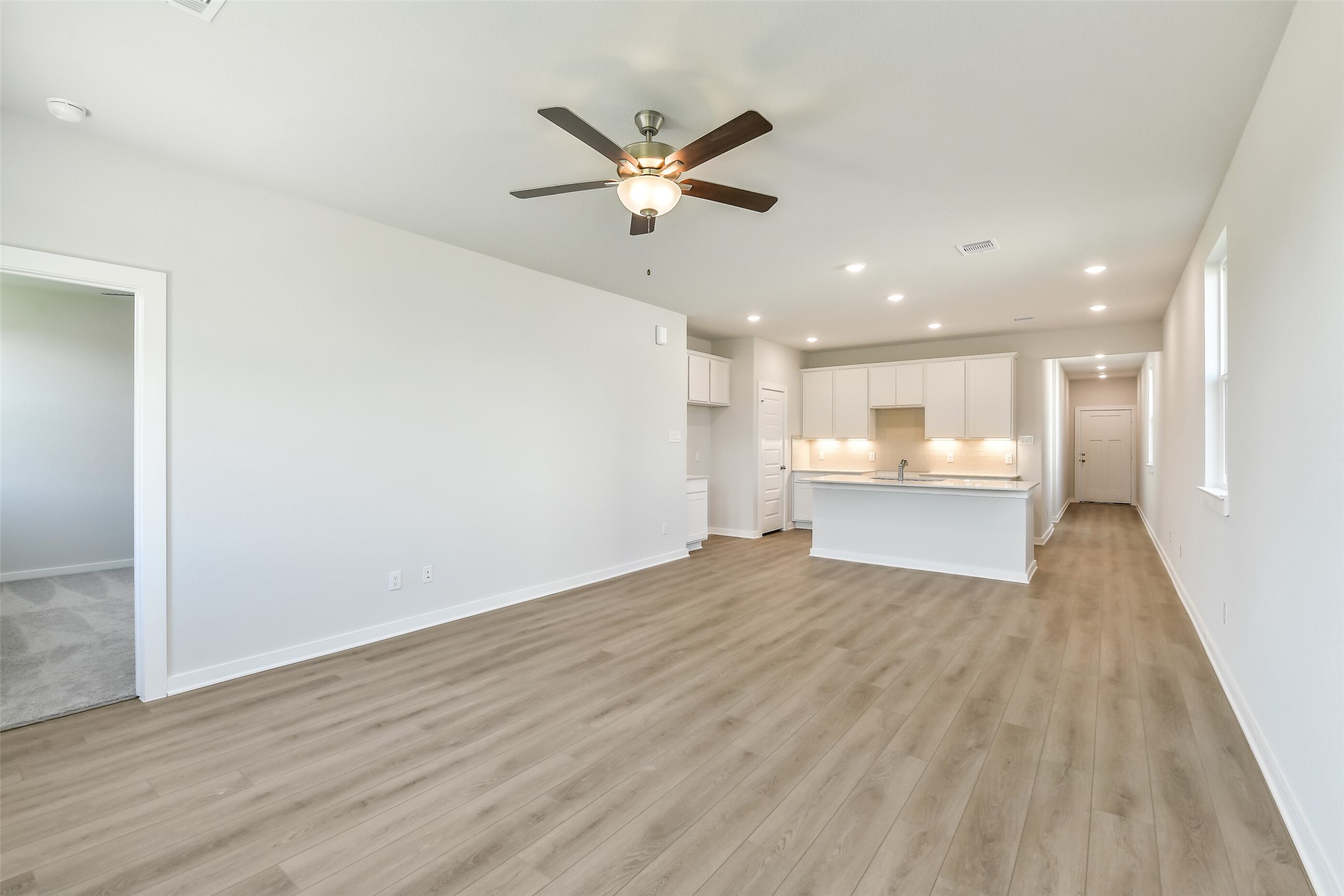 25984 Liberation Road Cleveland, TX 77328 - Photo 4 of 35 a view of empty room with wooden floor and window