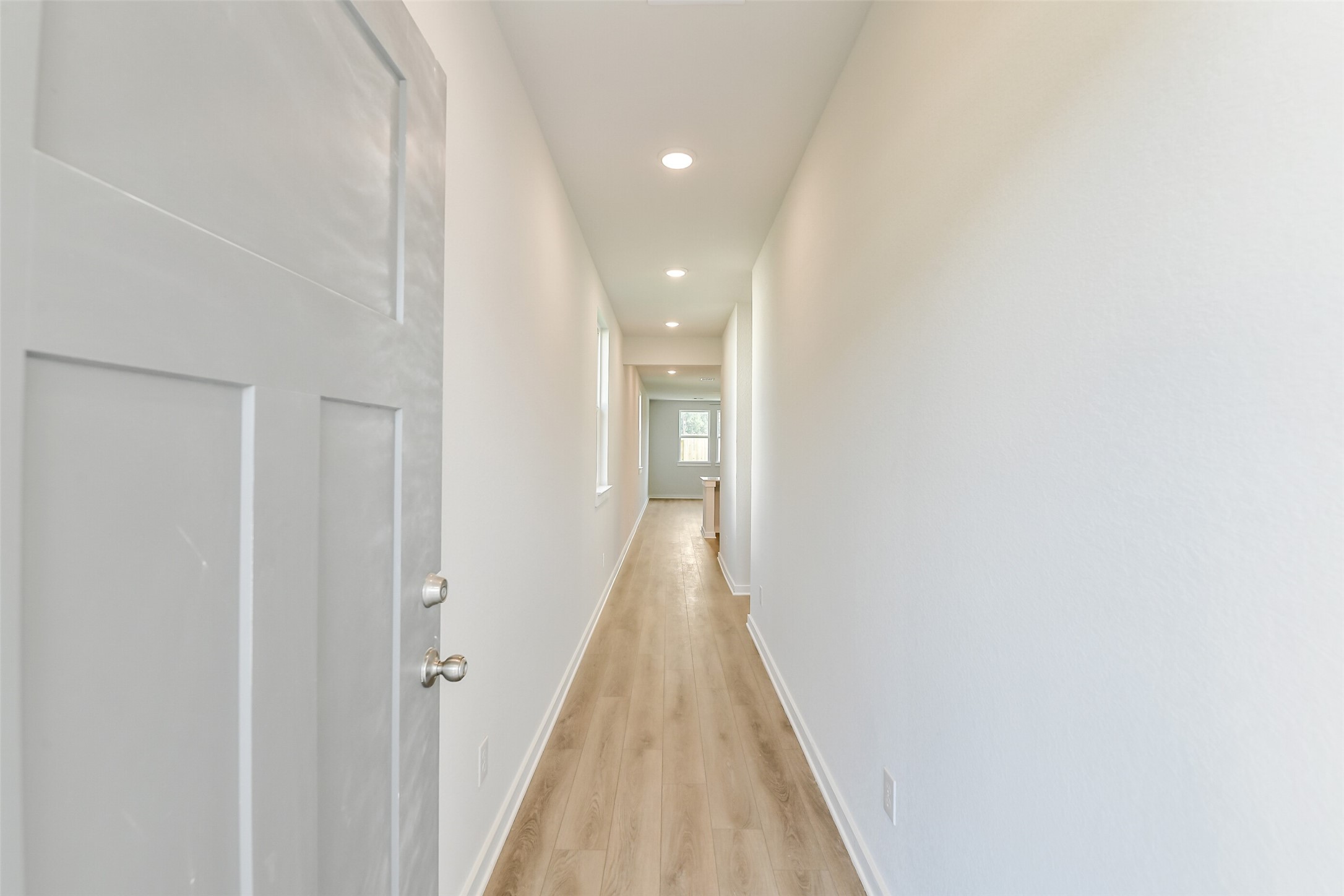 25984 Liberation Road Cleveland, TX 77328 - Photo 7 of 35 a view of a hallway with wooden floor