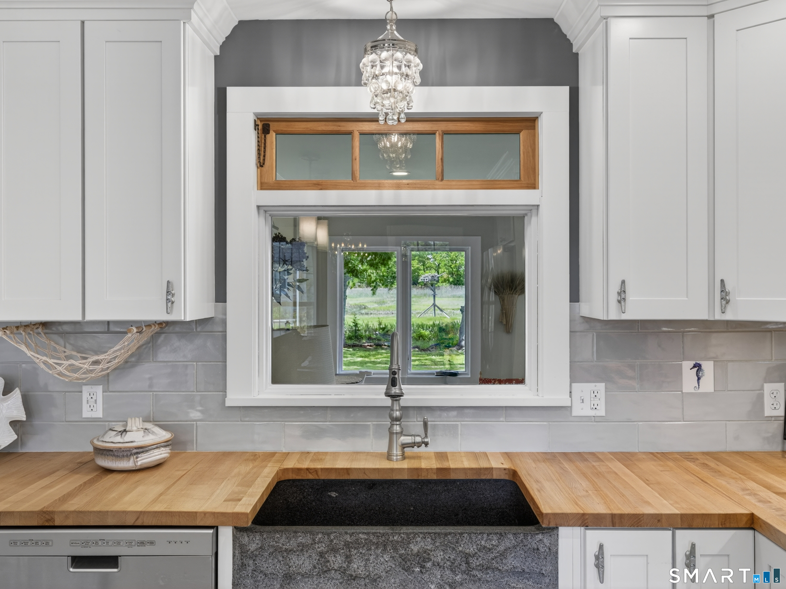 82 Pratt Road Clinton, CT 06413 - Photo 8 of 40 Impressive blue granite farmers sink facing window with a perfect view of the creek & Osprey nest.