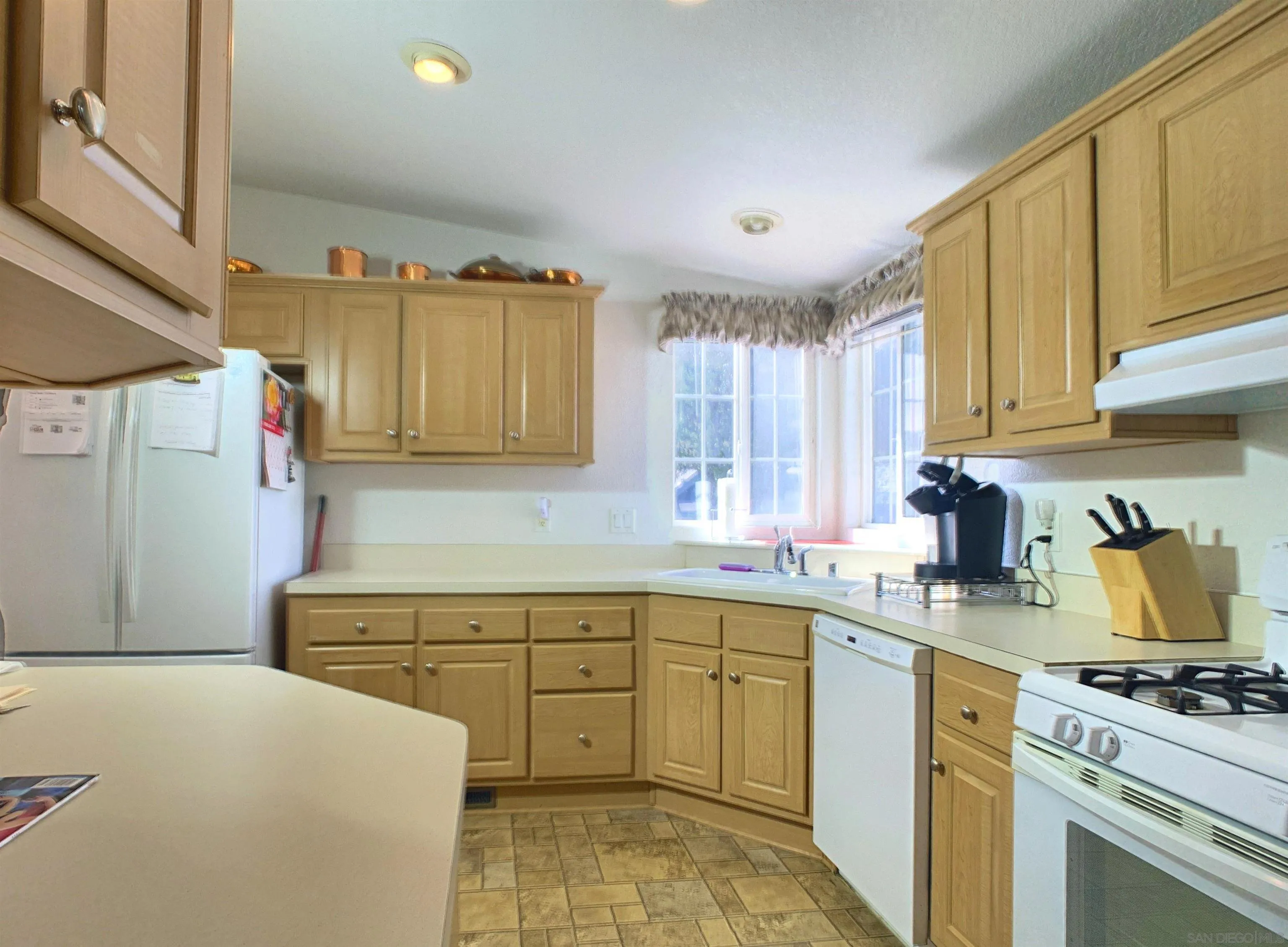 3505 Alpine Boulevard, Unit 57 Alpine, CA 91901 - Photo 12 of 28 The kitchen offers access to the dining area and breakfast area.